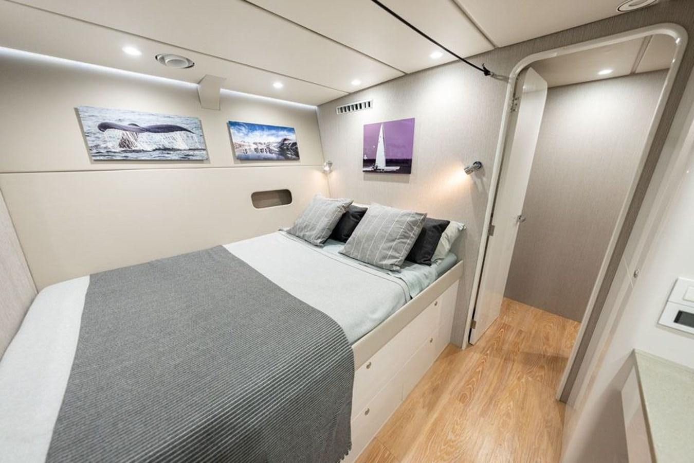 a room with two beds aboard COCHISE Yacht for Sale