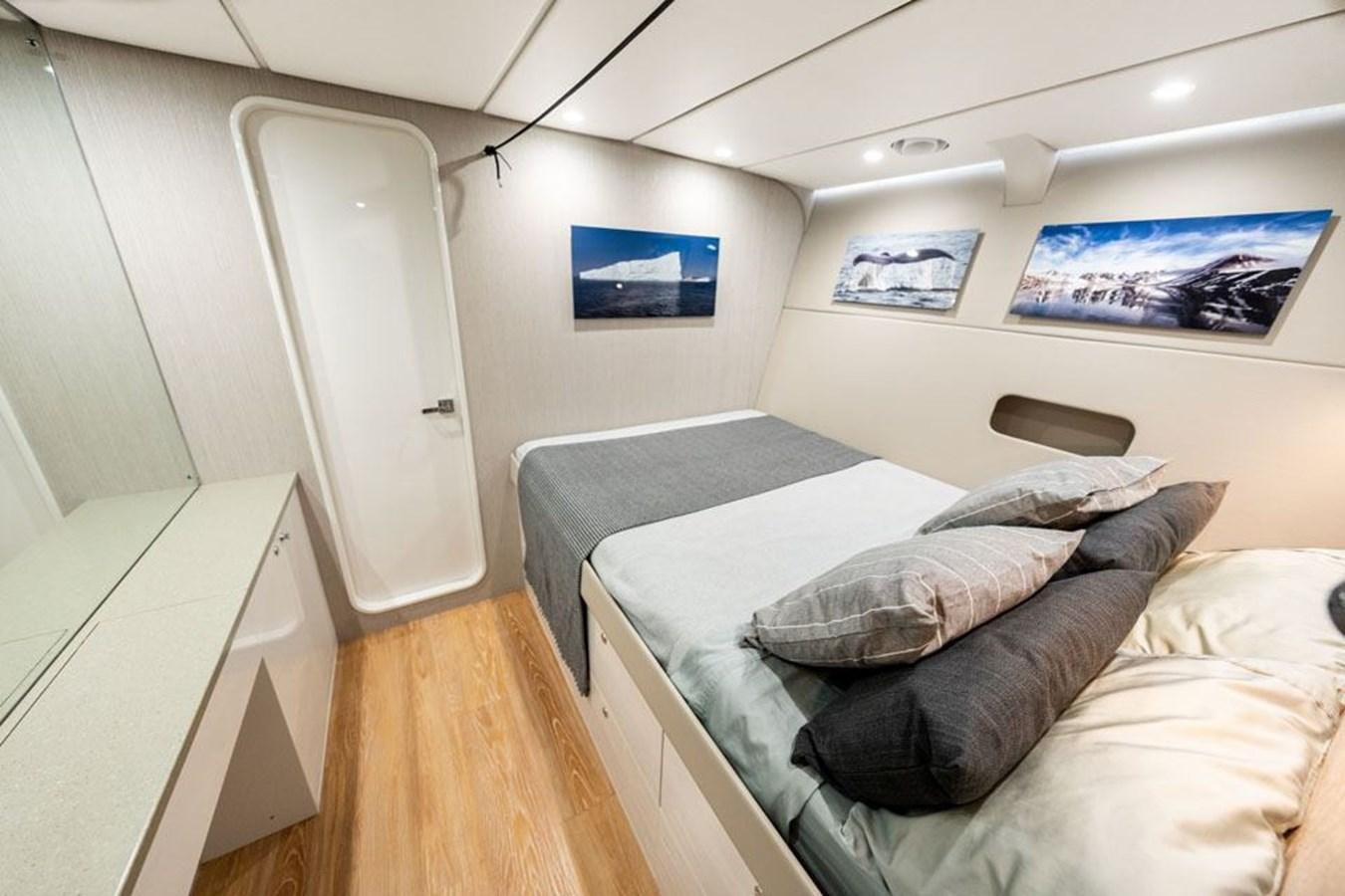 a bed in a room aboard COCHISE Yacht for Sale