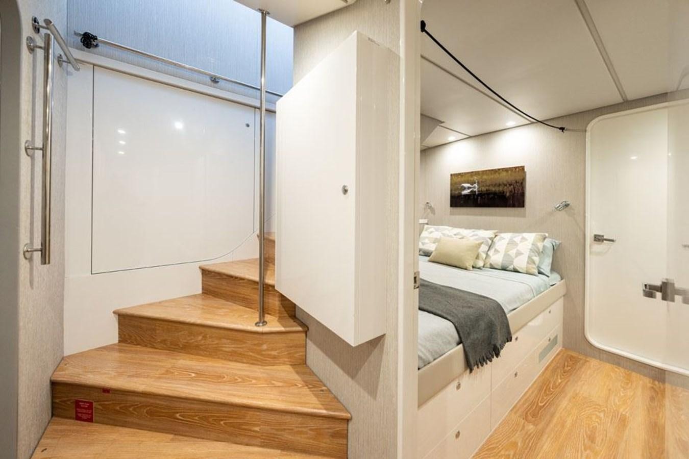 a room with a bed and a closet aboard COCHISE Yacht for Sale