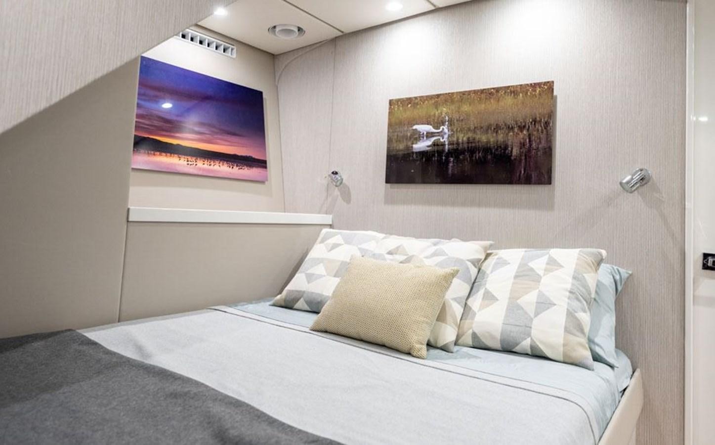 a bed with pillows aboard COCHISE Yacht for Sale