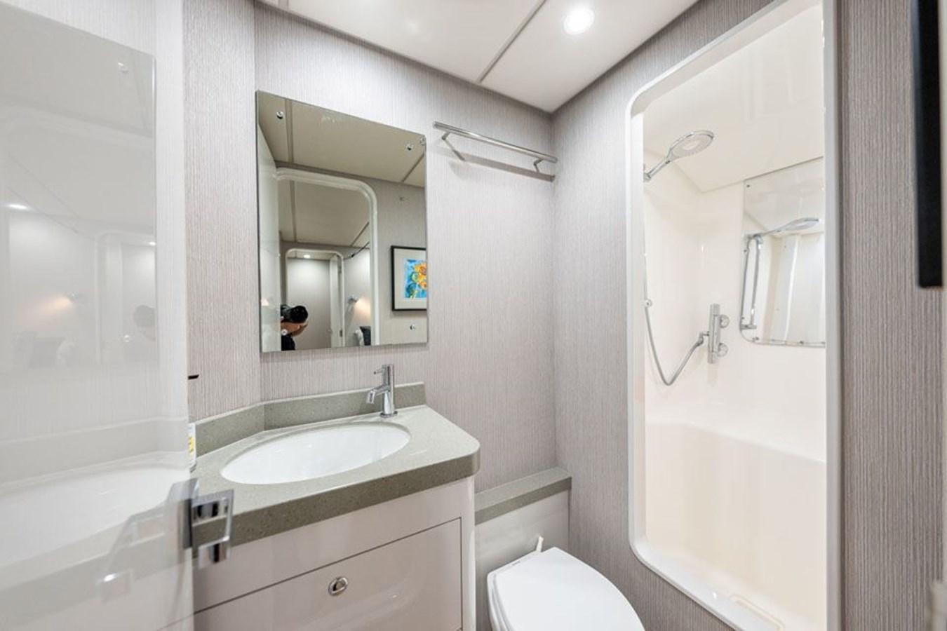 a bathroom with a sink and a bathtub aboard COCHISE Yacht for Sale