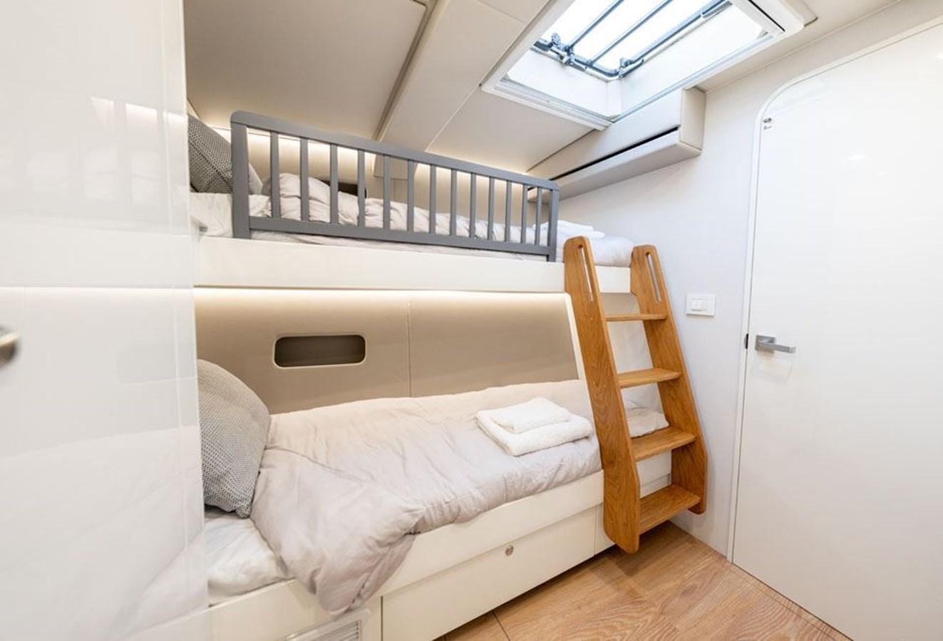 a bed in a room aboard COCHISE Yacht for Sale