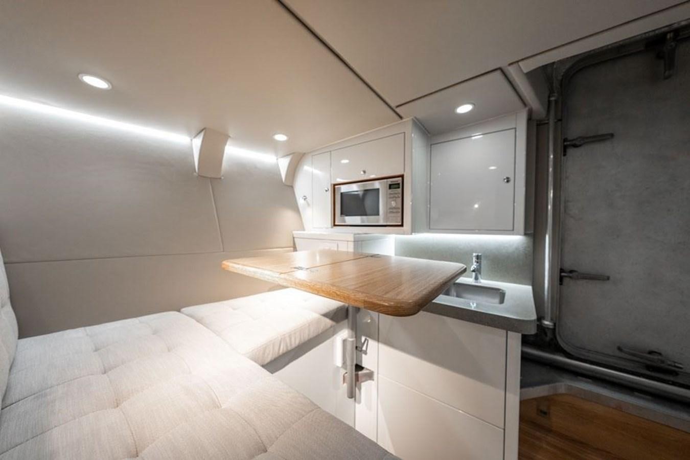 a room with a bed and a sink aboard COCHISE Yacht for Sale