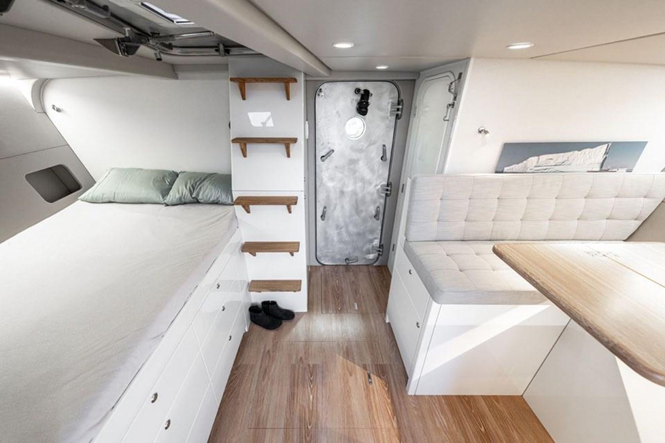 a room with bunk beds aboard COCHISE Yacht for Sale