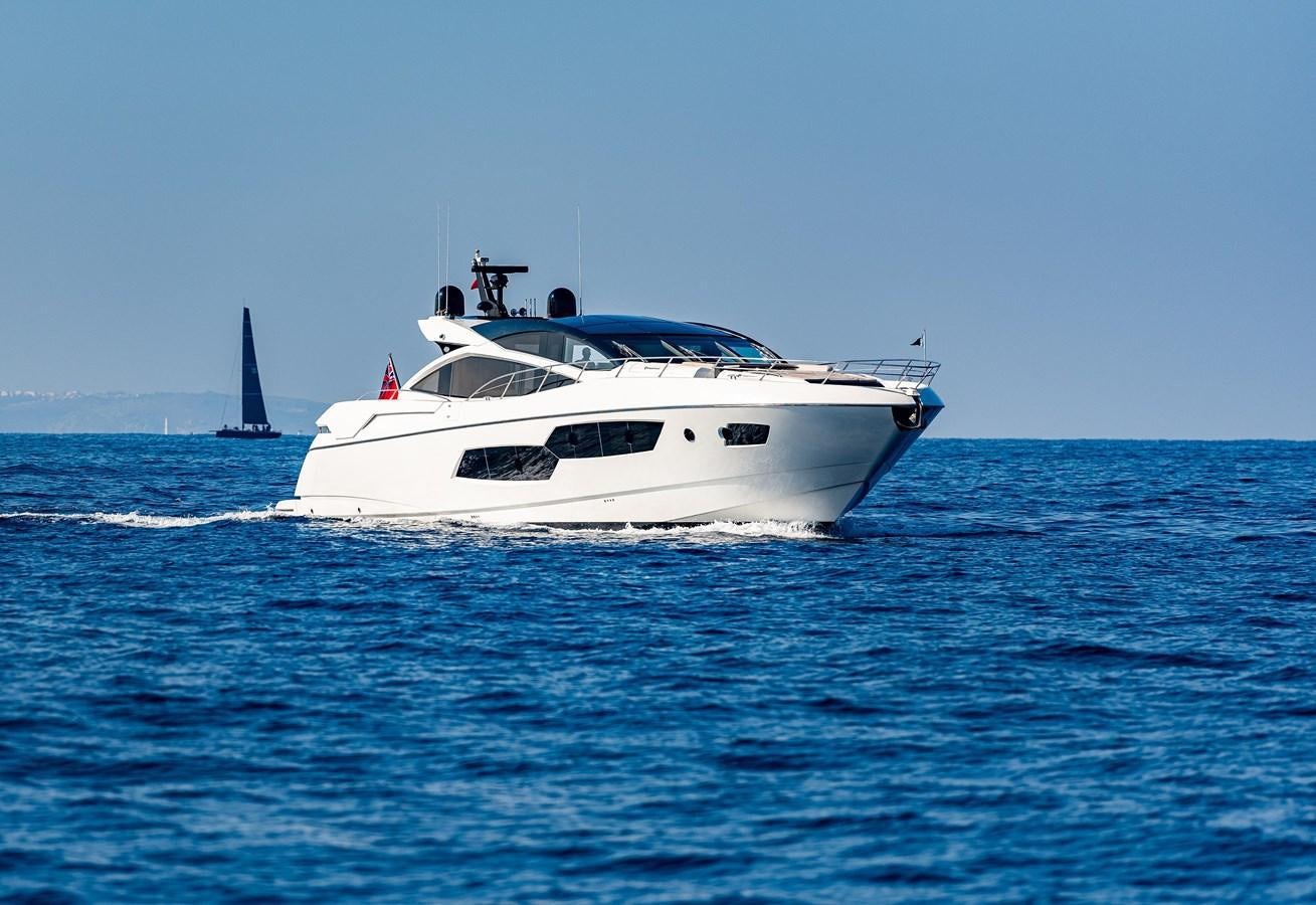 a white boat in the water aboard CLAVIS Yacht for Sale