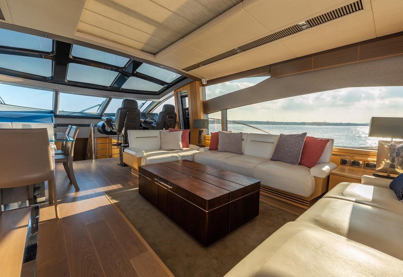 a living room with a large window aboard CLAVIS Yacht for Sale