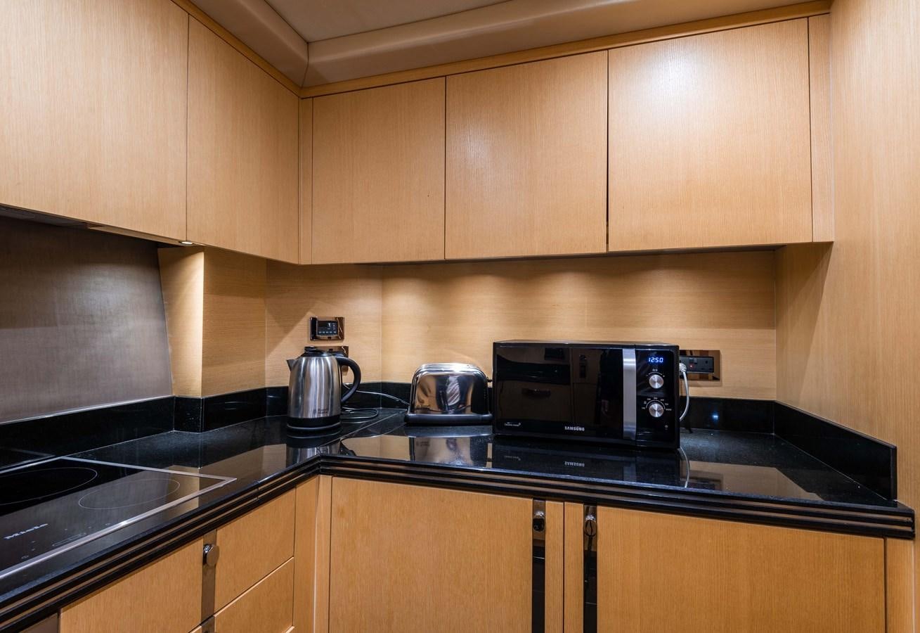 a kitchen with a coffee maker aboard CLAVIS Yacht for Sale