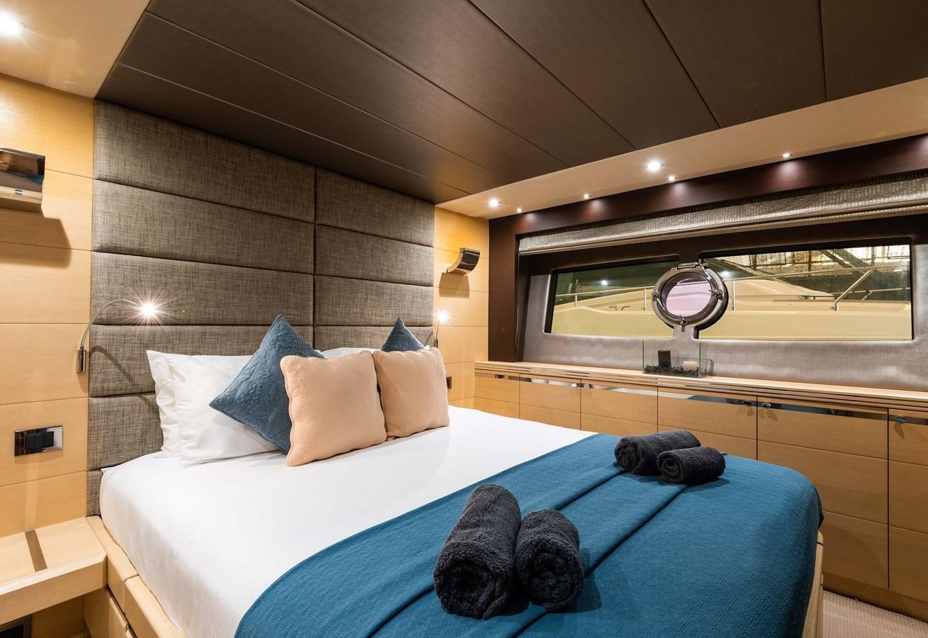 a room with a bed and a window aboard CLAVIS Yacht for Sale