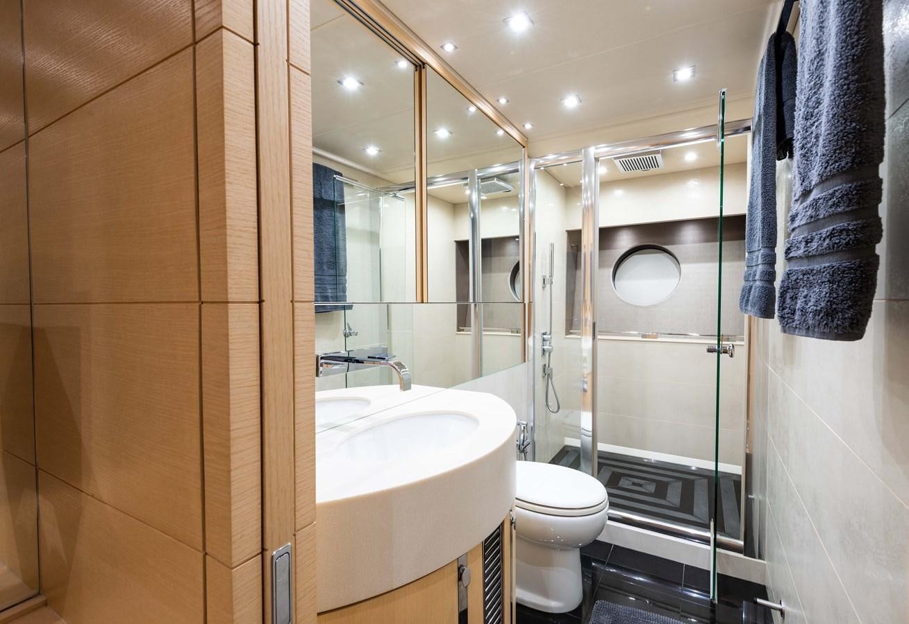 a bathroom with a glass shower aboard CLAVIS Yacht for Sale
