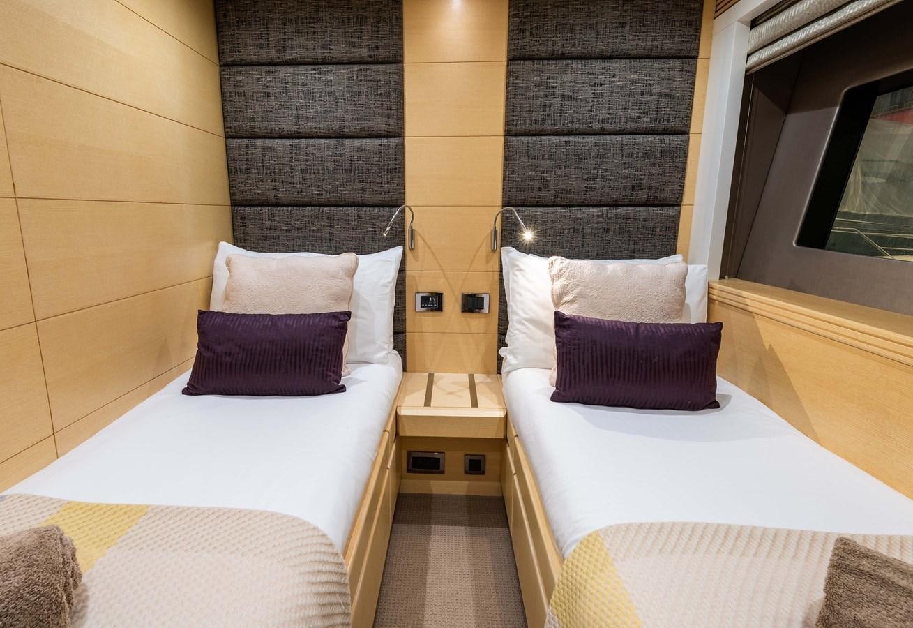 a room with beds and a tv aboard CLAVIS Yacht for Sale