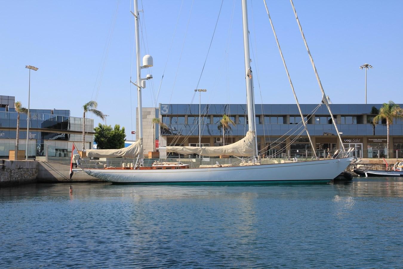 a boat docked at a pier aboard KIM Yacht for Sale