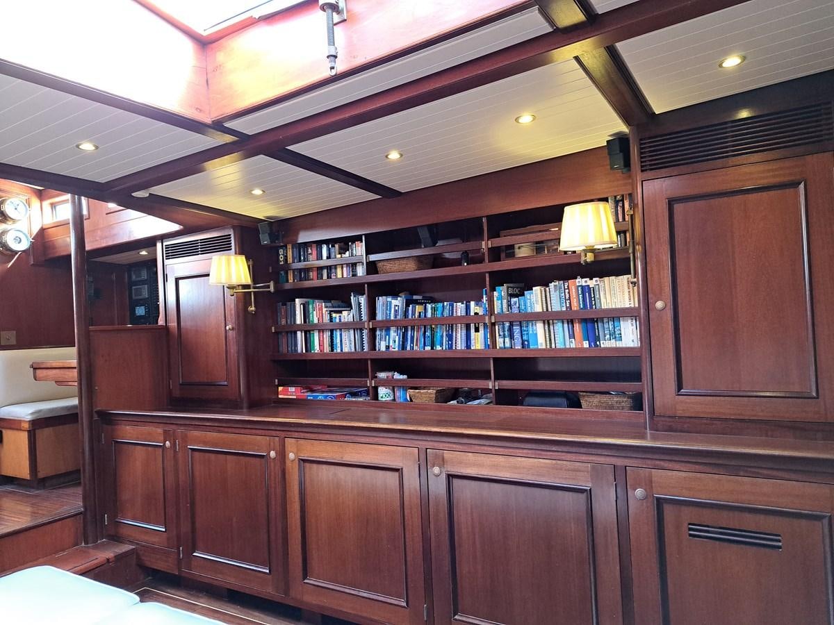 a room with a shelf and a bookcase aboard KIM Yacht for Sale