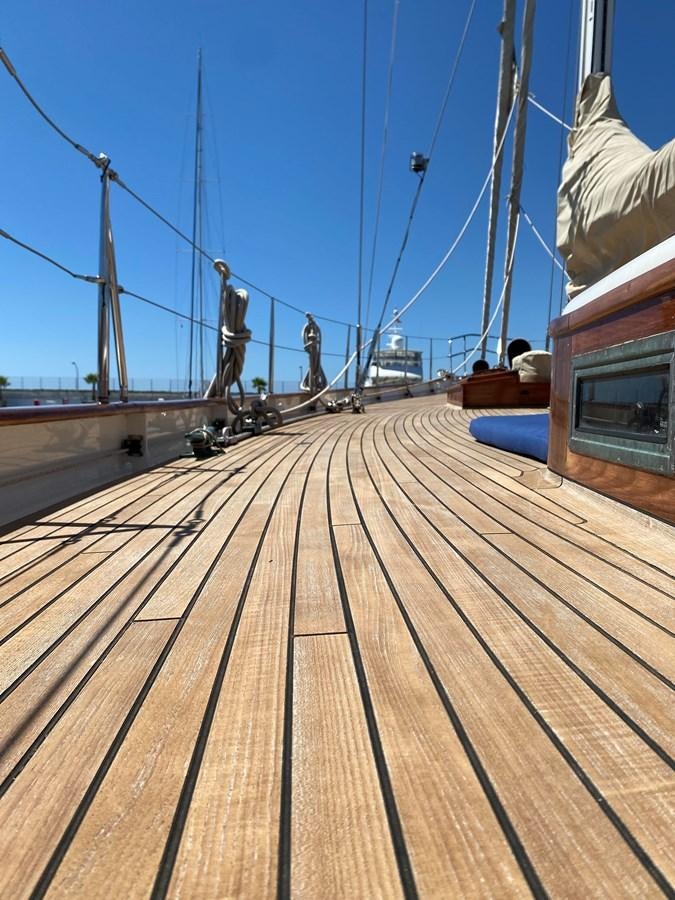 a wooden dock with a boat on it aboard KIM Yacht for Sale