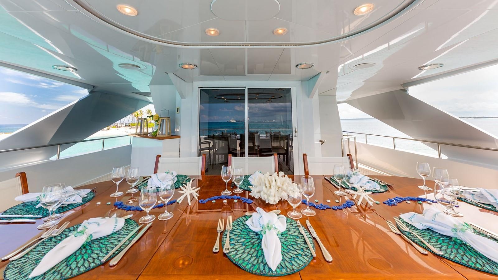a large room with tables and chairs aboard AT LAST Yacht for Charter