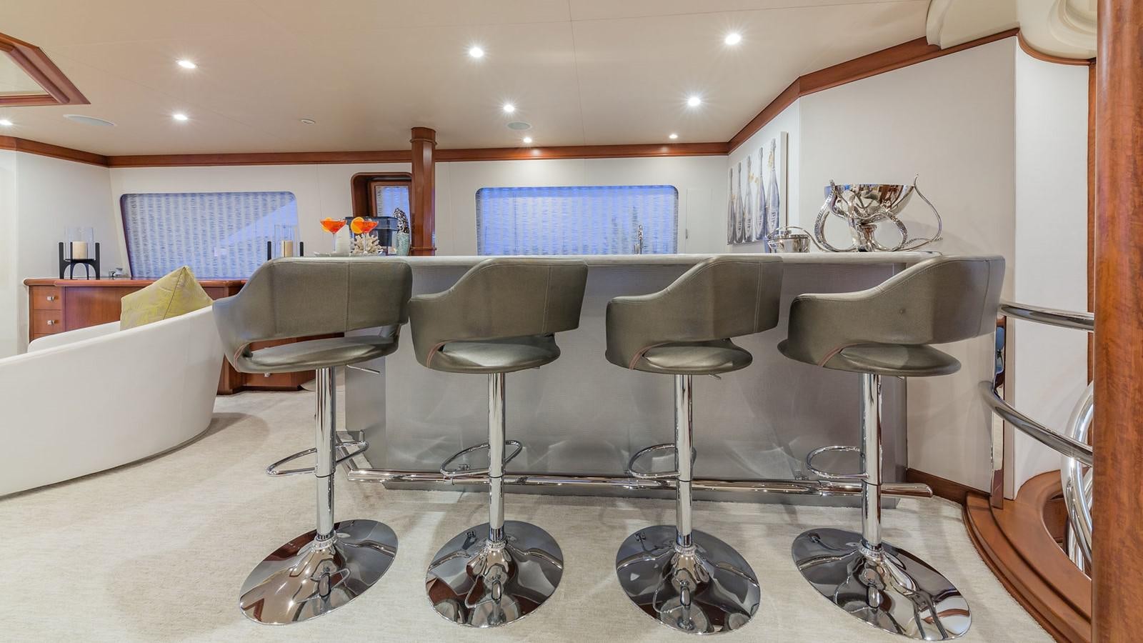 a room with a table and chairs aboard AT LAST Yacht for Charter