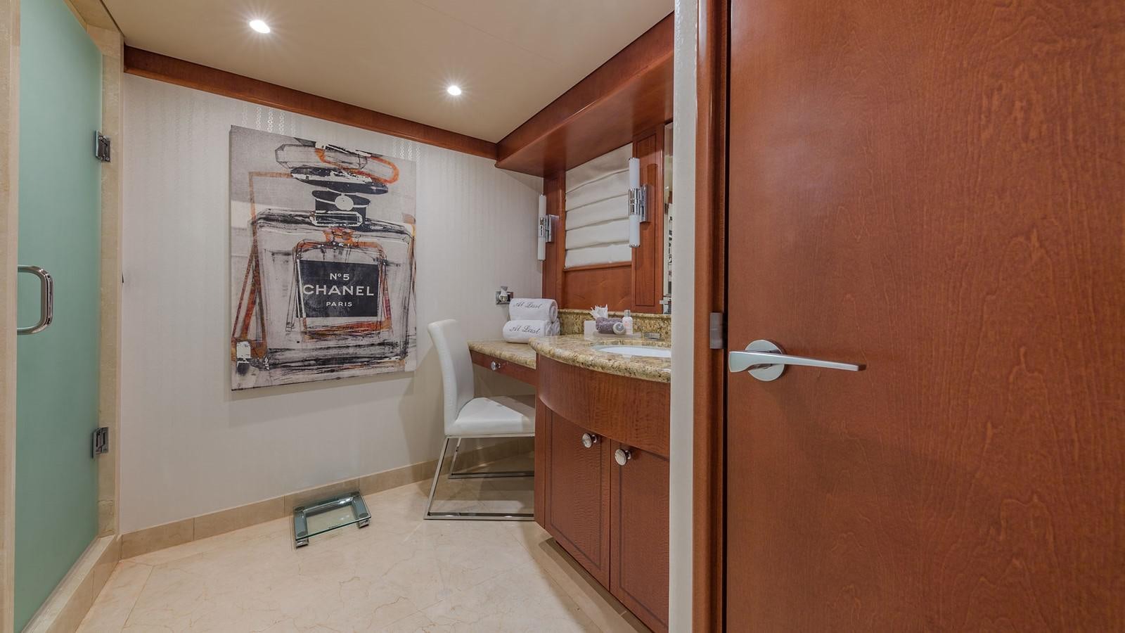 a room with a desk and a chair aboard AT LAST Yacht for Charter