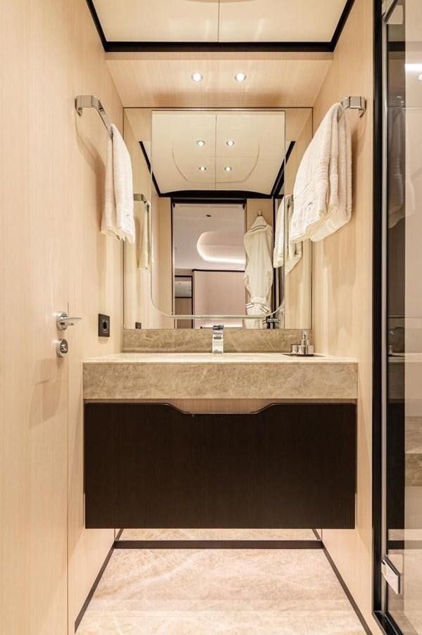 a bathroom with a large mirror aboard QUEEN J II Yacht for Sale