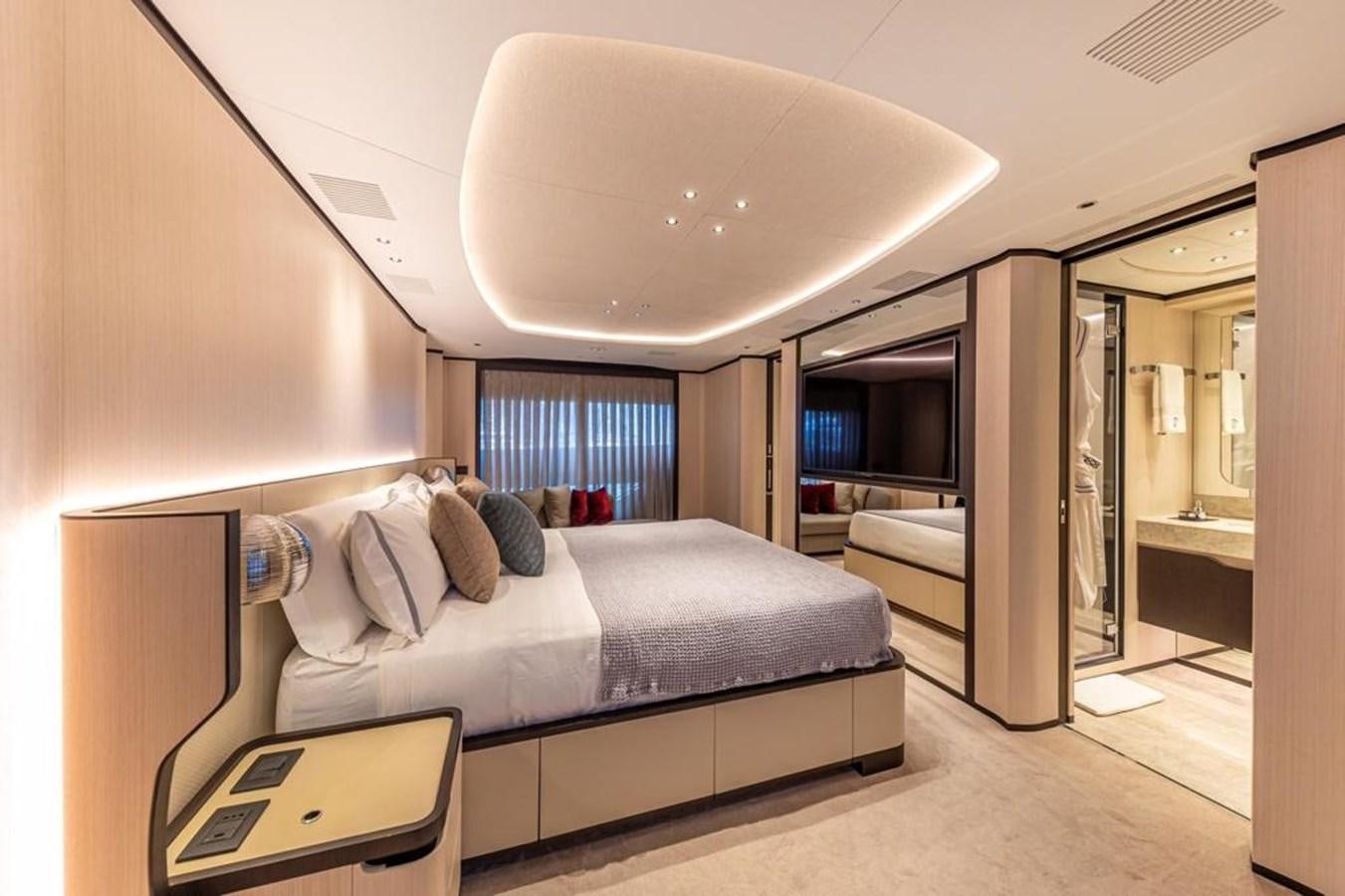 a bed in a room aboard QUEEN J II Yacht for Sale