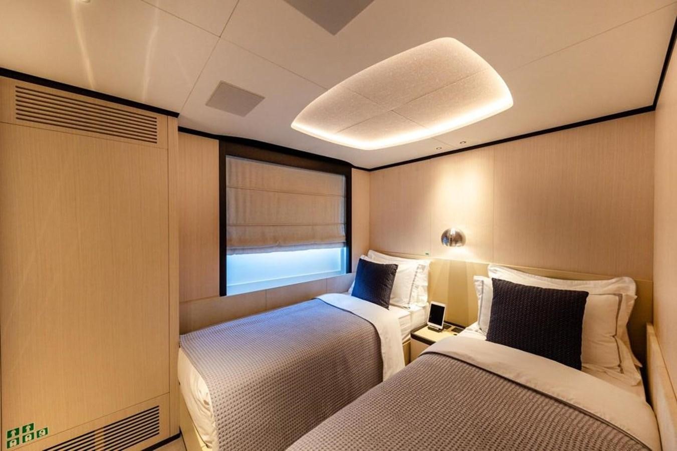 a room with two beds aboard QUEEN J II Yacht for Sale