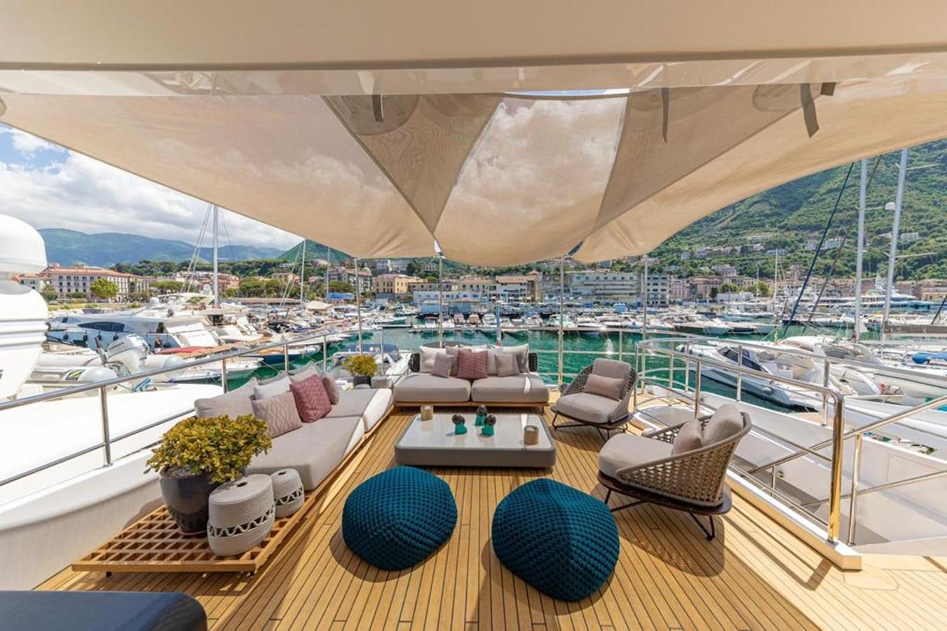 a room with a view of a city and a large body of water aboard QUEEN J II Yacht for Sale