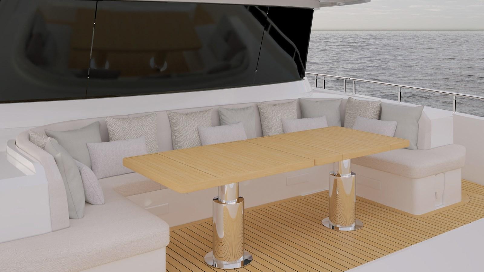 a table with a white couch and a white sofa aboard OLIVIA Yacht for Sale