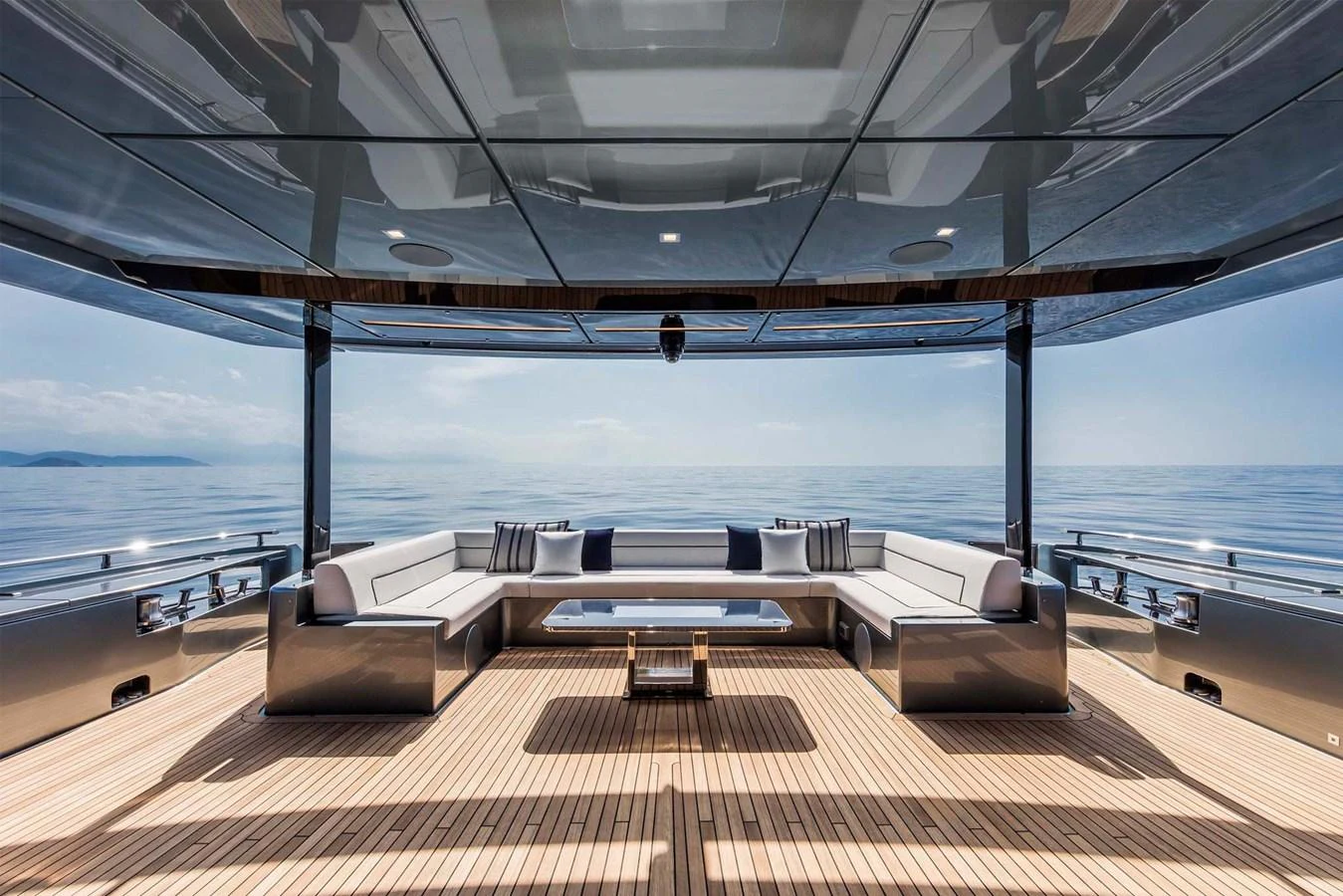 a room with a couch and a table aboard RIVA 110/27 DOLCEVITA Yacht for Sale