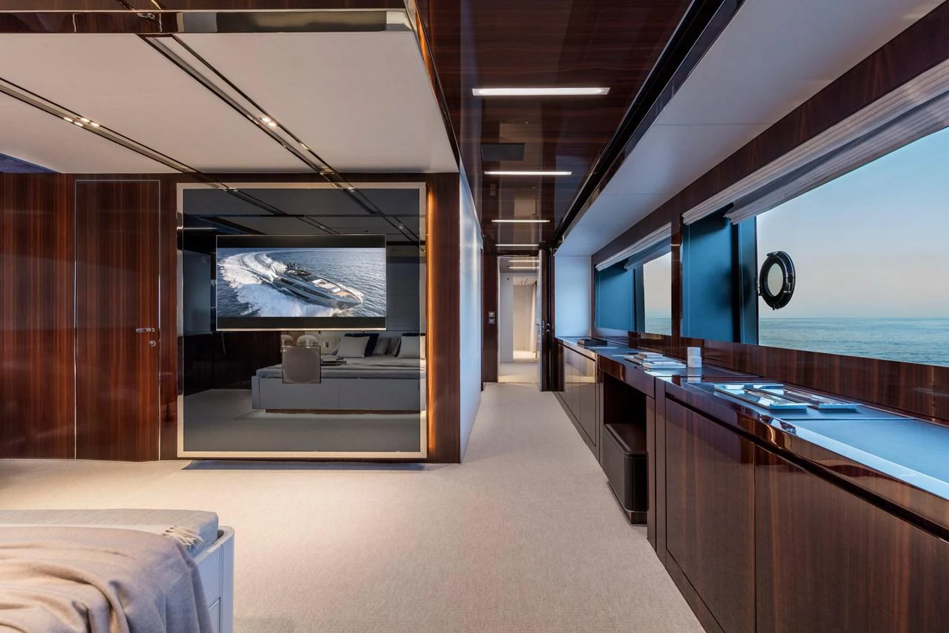 a room with a bed and a large window aboard RIVA 110/27 DOLCEVITA Yacht for Sale