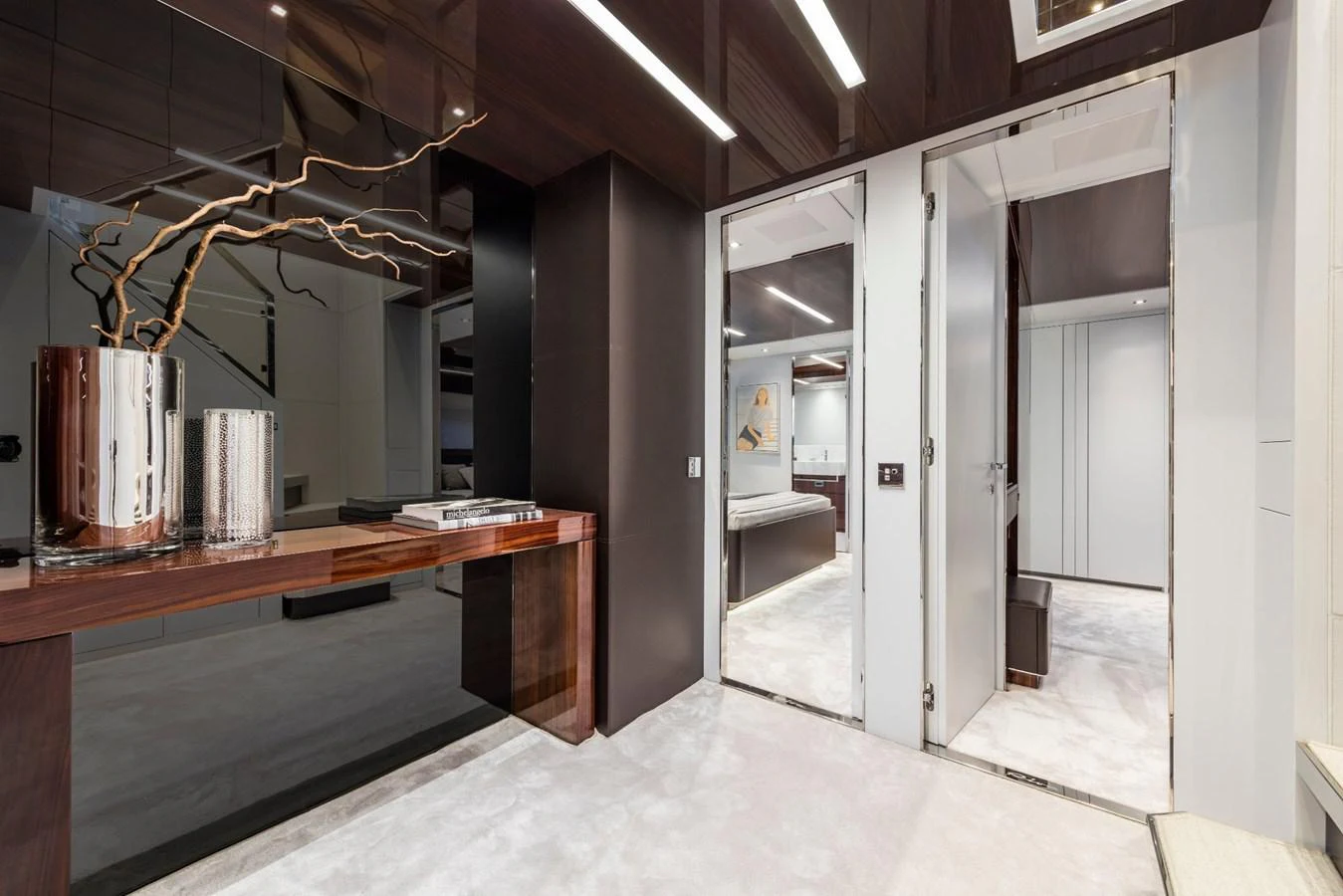 a room with a desk and a large mirror aboard RIVA 110/27 DOLCEVITA Yacht for Sale