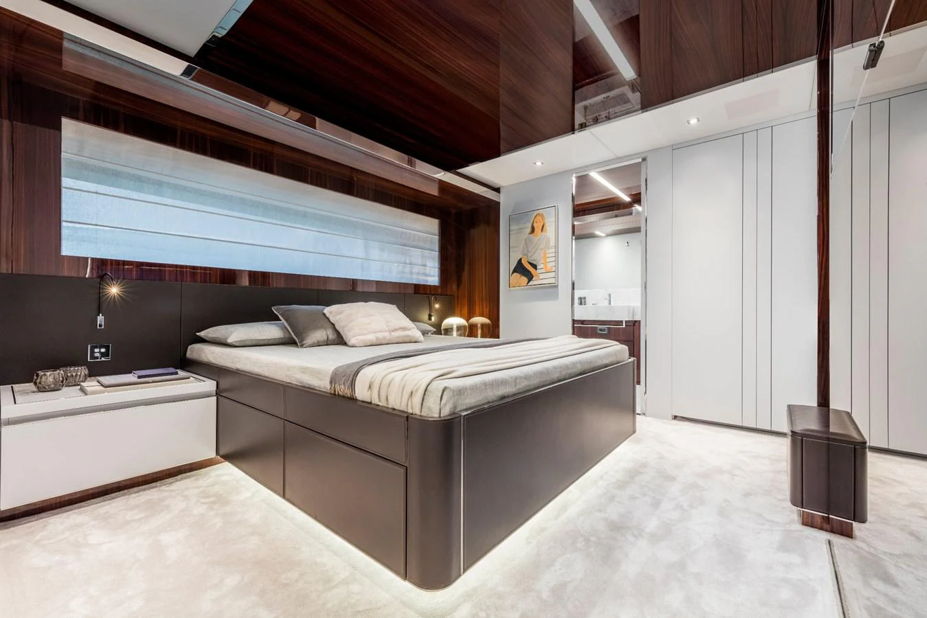 a room with a bed and a desk aboard RIVA 110/27 DOLCEVITA Yacht for Sale