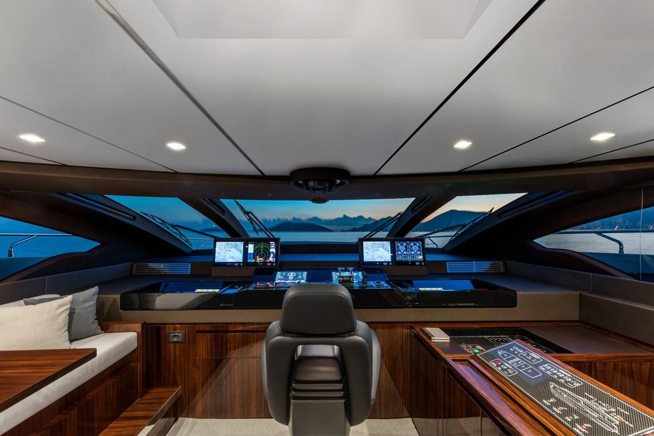 inside of a vehicle with a desk and chairs and a computer on the ceiling aboard PERRI BEACH Yacht for Sale