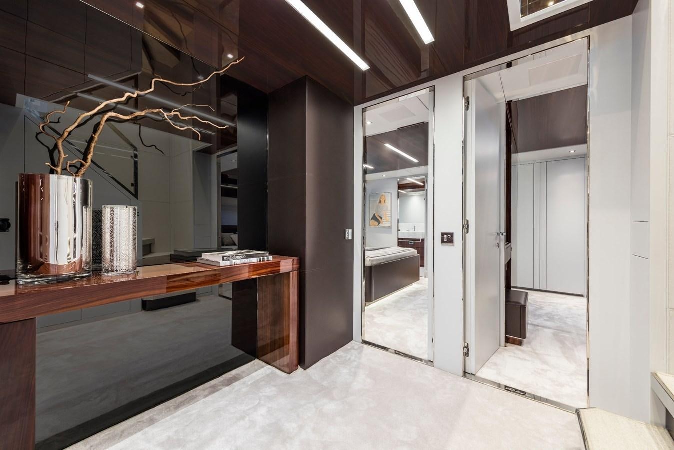 a room with a desk and a large mirror aboard PERRI BEACH Yacht for Sale