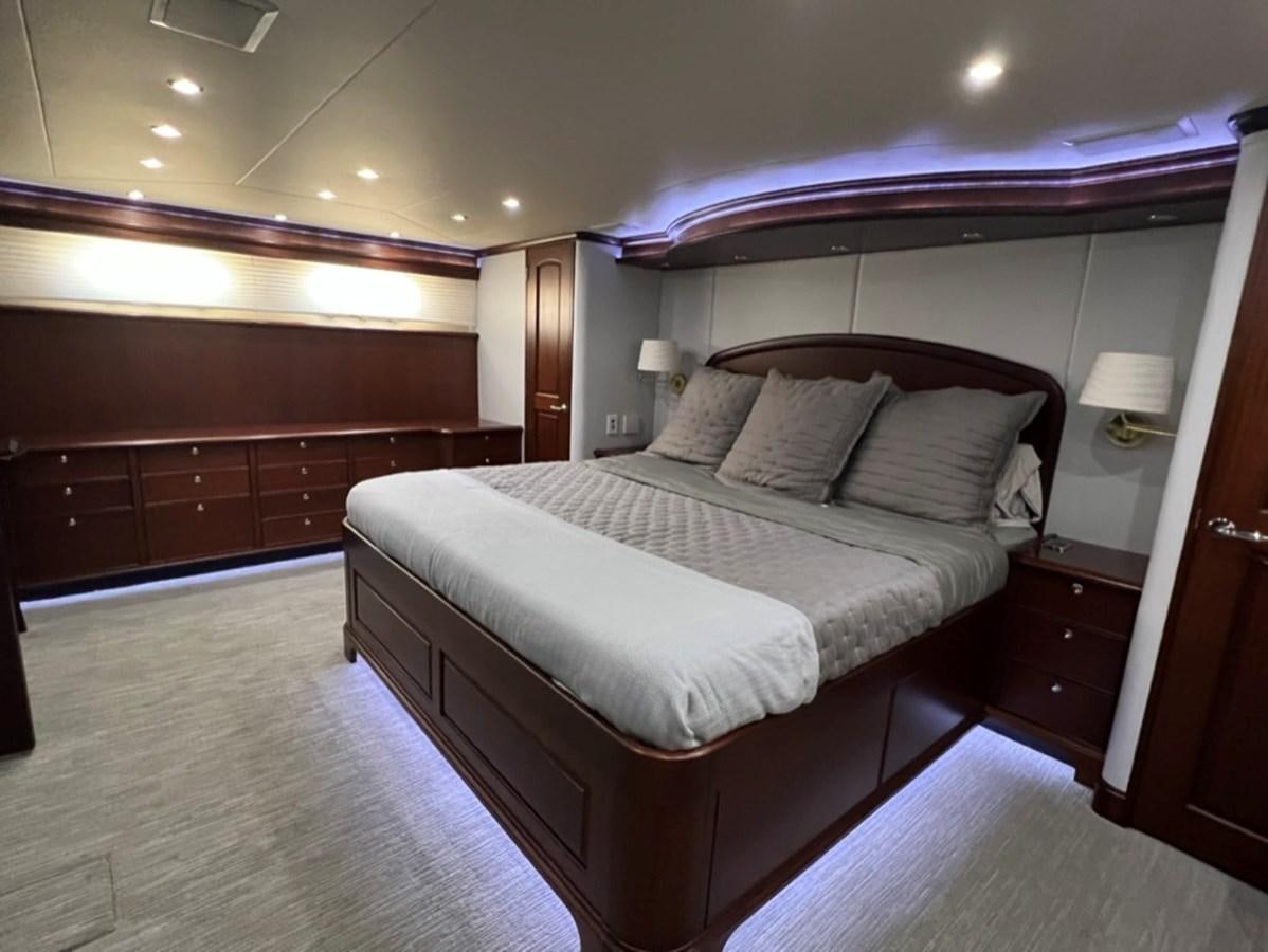 a bed in a room aboard LUCKY AGAIN Yacht for Sale