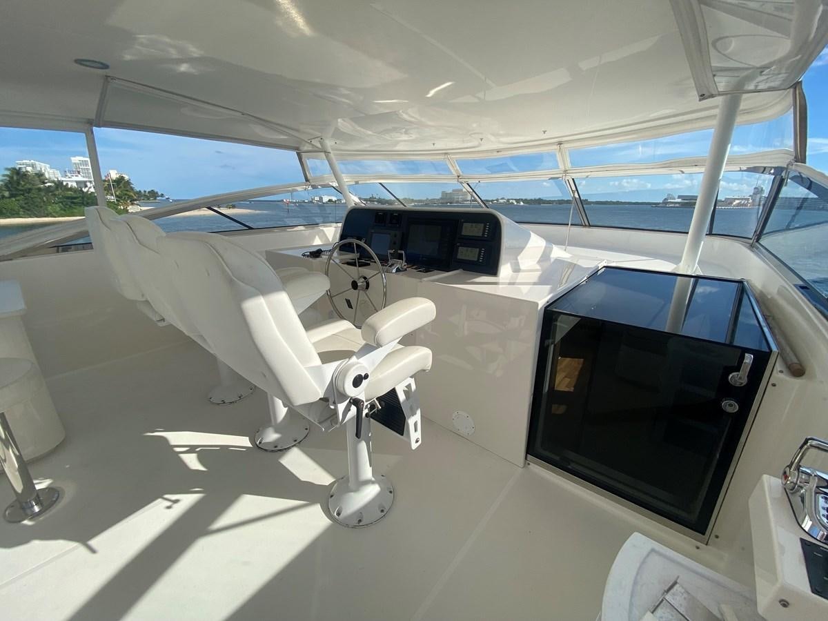 a white airplane with a black screen aboard LUCKY AGAIN Yacht for Sale