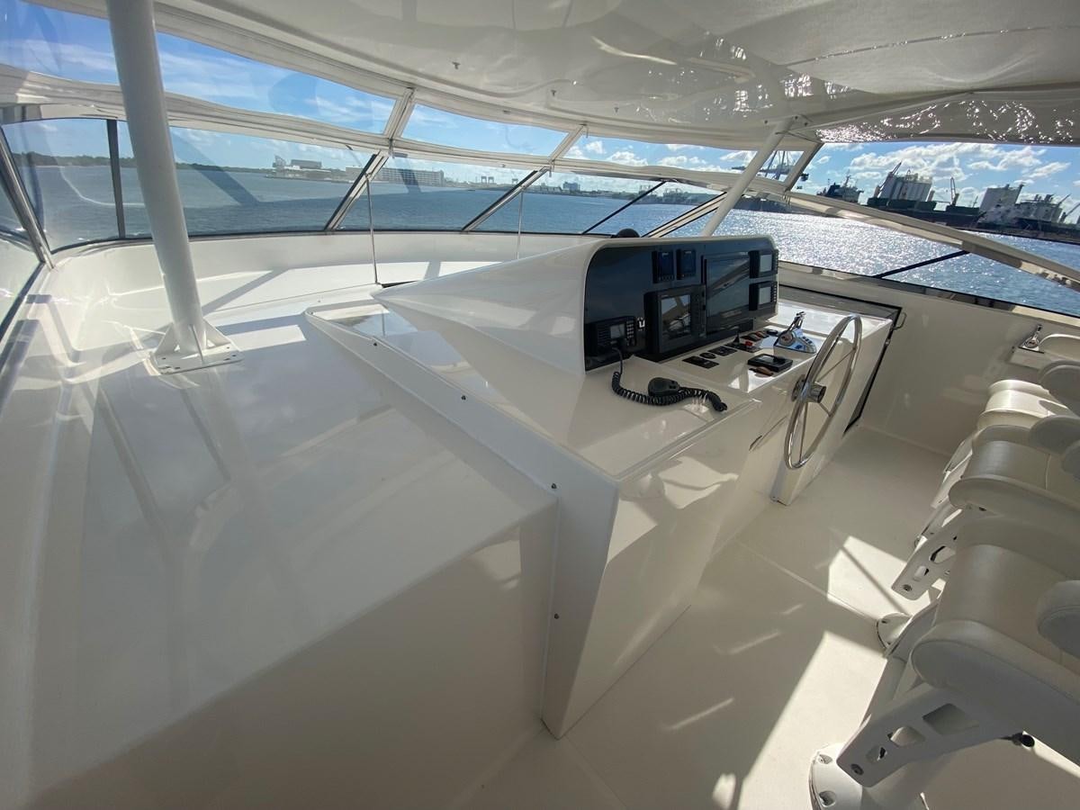 a view of a large room with machines and a large window aboard LUCKY AGAIN Yacht for Sale
