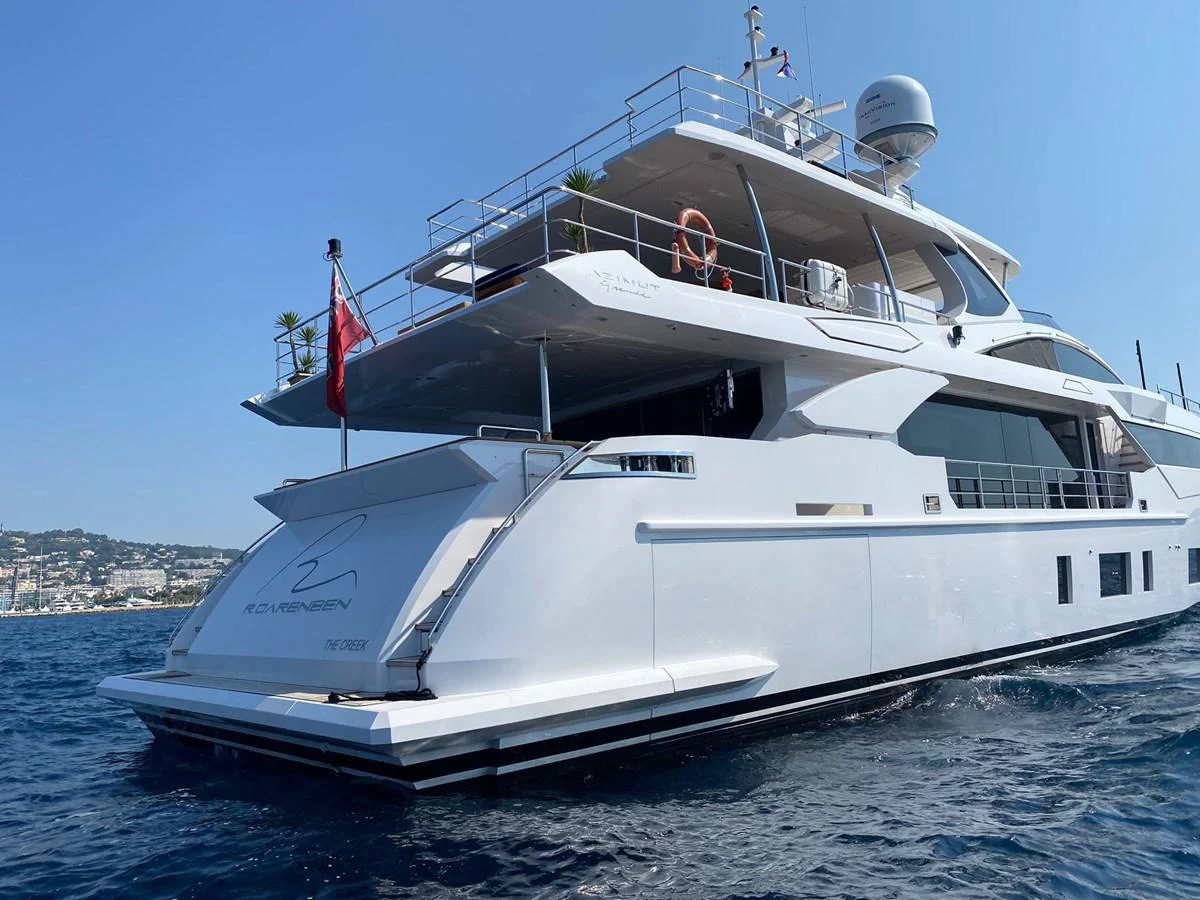 a large white boat on the water aboard R.DARENBEN Yacht for Sale