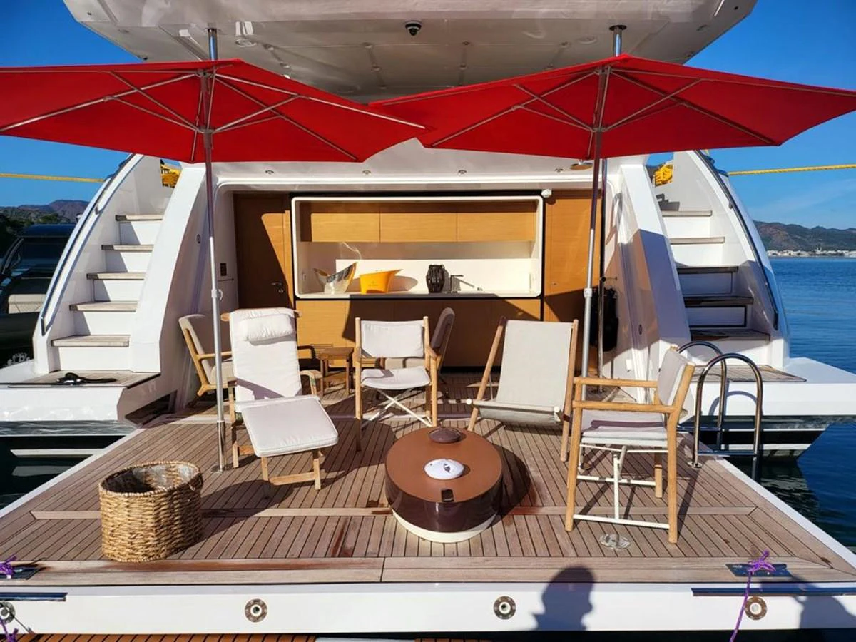 a boat with a table and chairs on it aboard R.DARENBEN Yacht for Sale