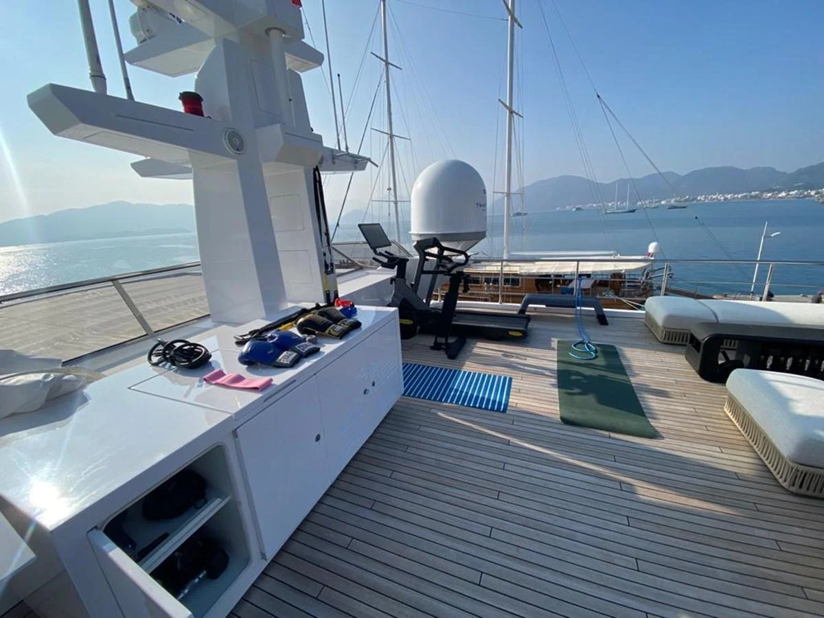 a boat deck with a boat and a satellite dish on it aboard R.DARENBEN Yacht for Sale