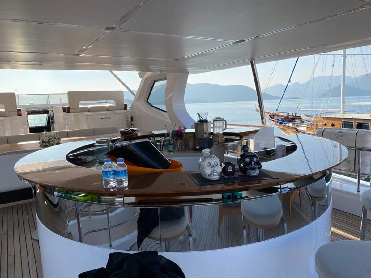 a room with a table and chairs aboard R.DARENBEN Yacht for Sale