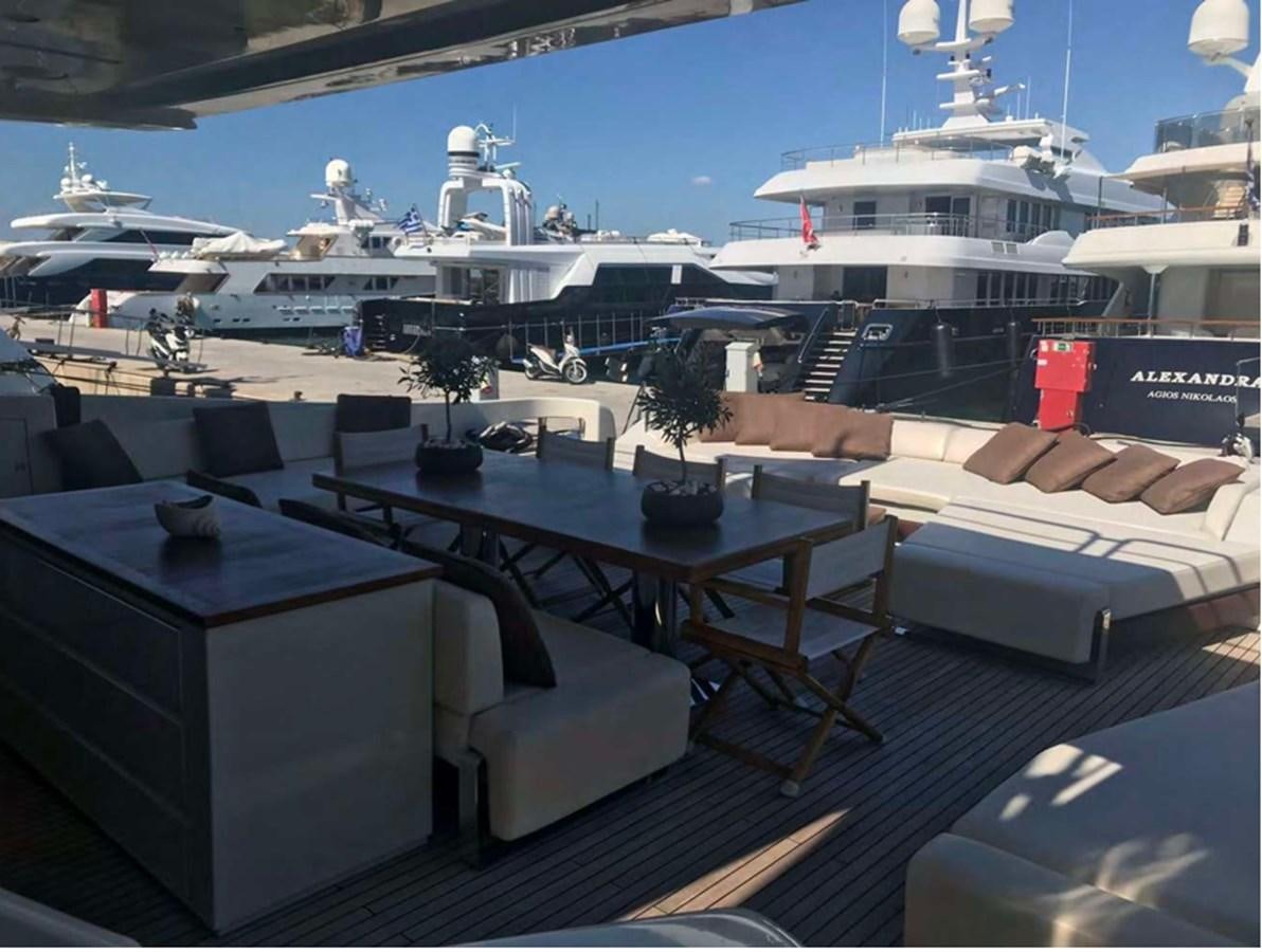a room with a table and chairs aboard DUKE Yacht for Sale