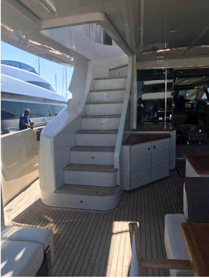 a white staircase in a room aboard DUKE Yacht for Sale