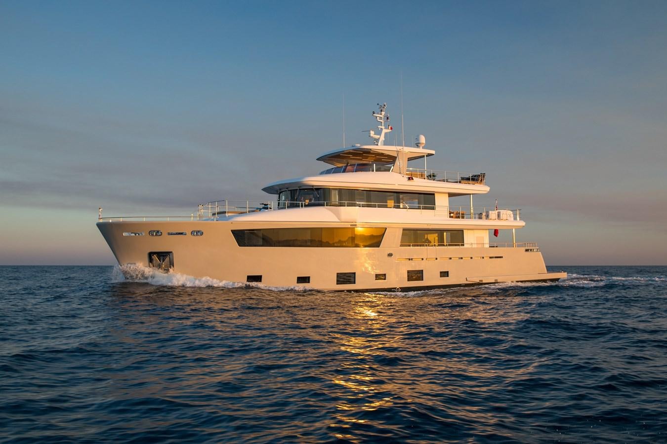 a large white boat in the water aboard SABAI Yacht for Sale