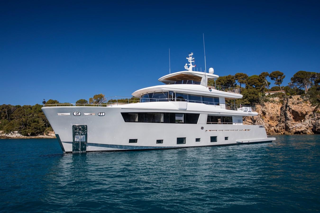 a large white boat in the water aboard SABAI Yacht for Sale