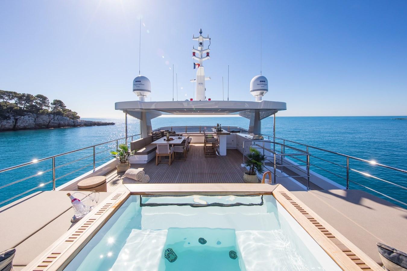 a dock with a pool and a boat on it aboard SABAI Yacht for Sale