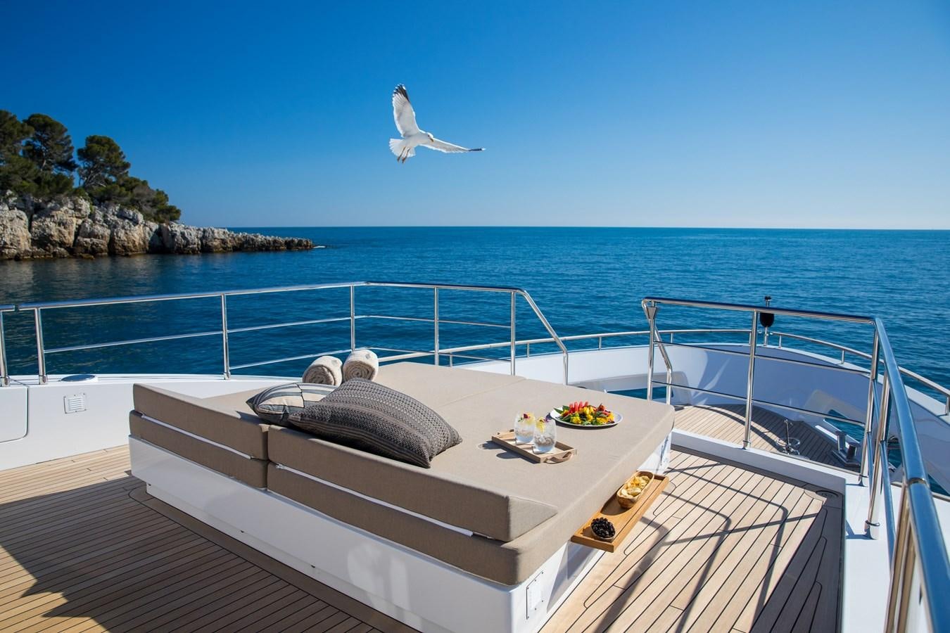 a bird flying over a boat aboard SABAI Yacht for Sale