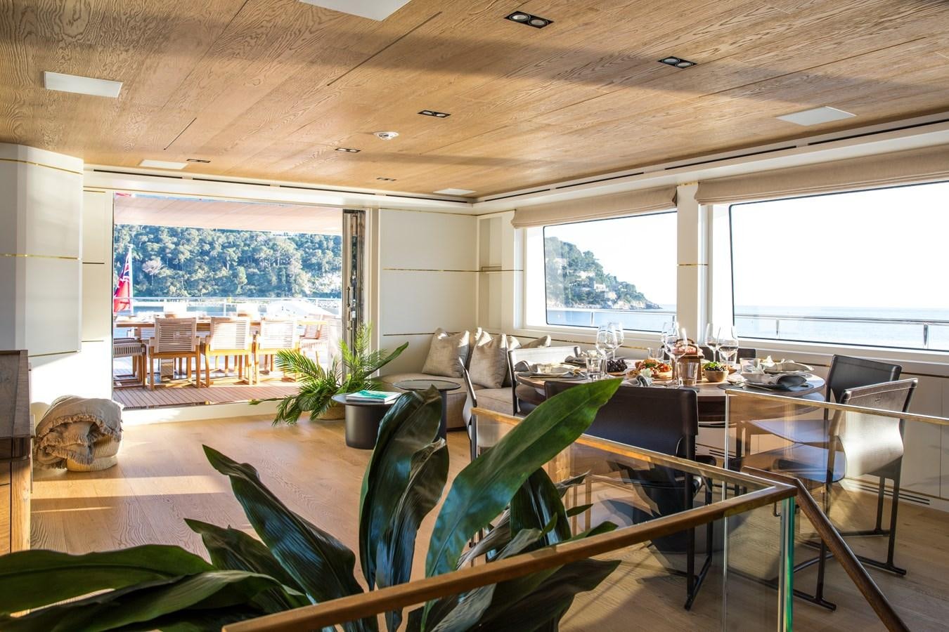a living room with a large window aboard SABAI Yacht for Sale