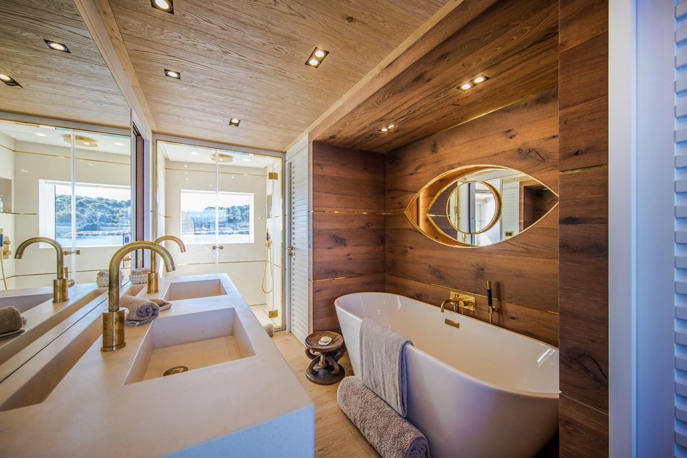 a bathroom with a large tub aboard SABAI Yacht for Sale