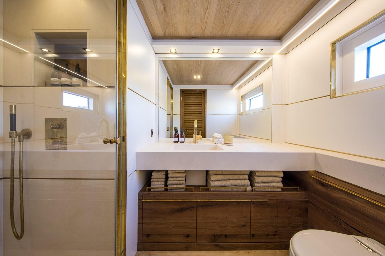 a bathroom with a sink and a mirror aboard SABAI Yacht for Sale