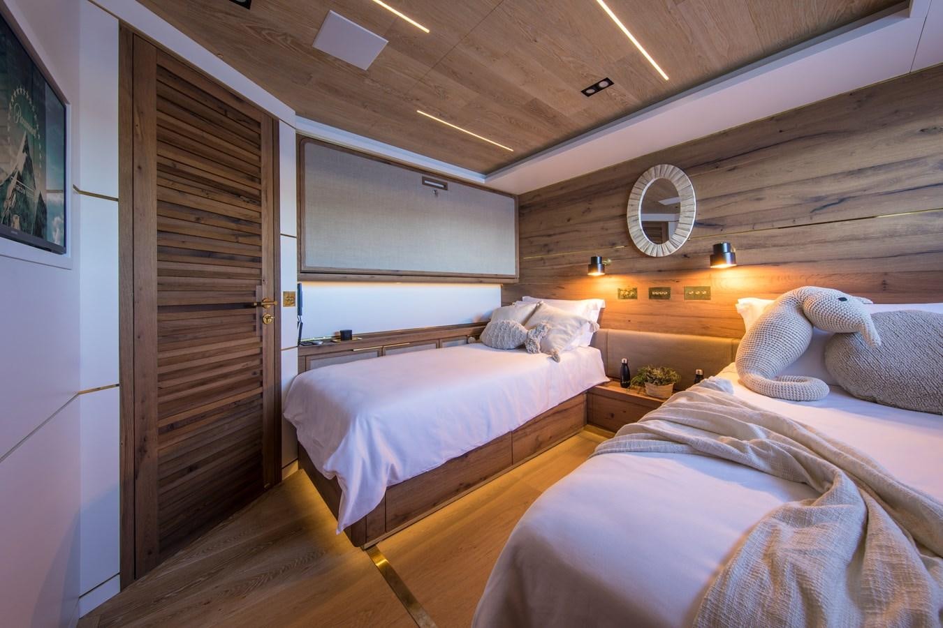 a room with two beds aboard SABAI Yacht for Sale