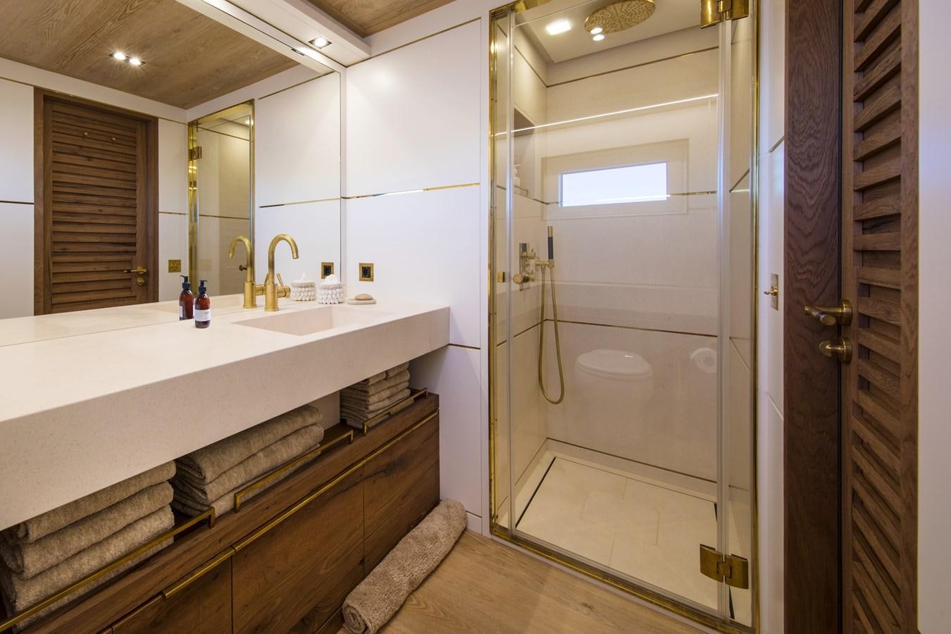 a bathroom with a sink and a shower aboard SABAI Yacht for Sale