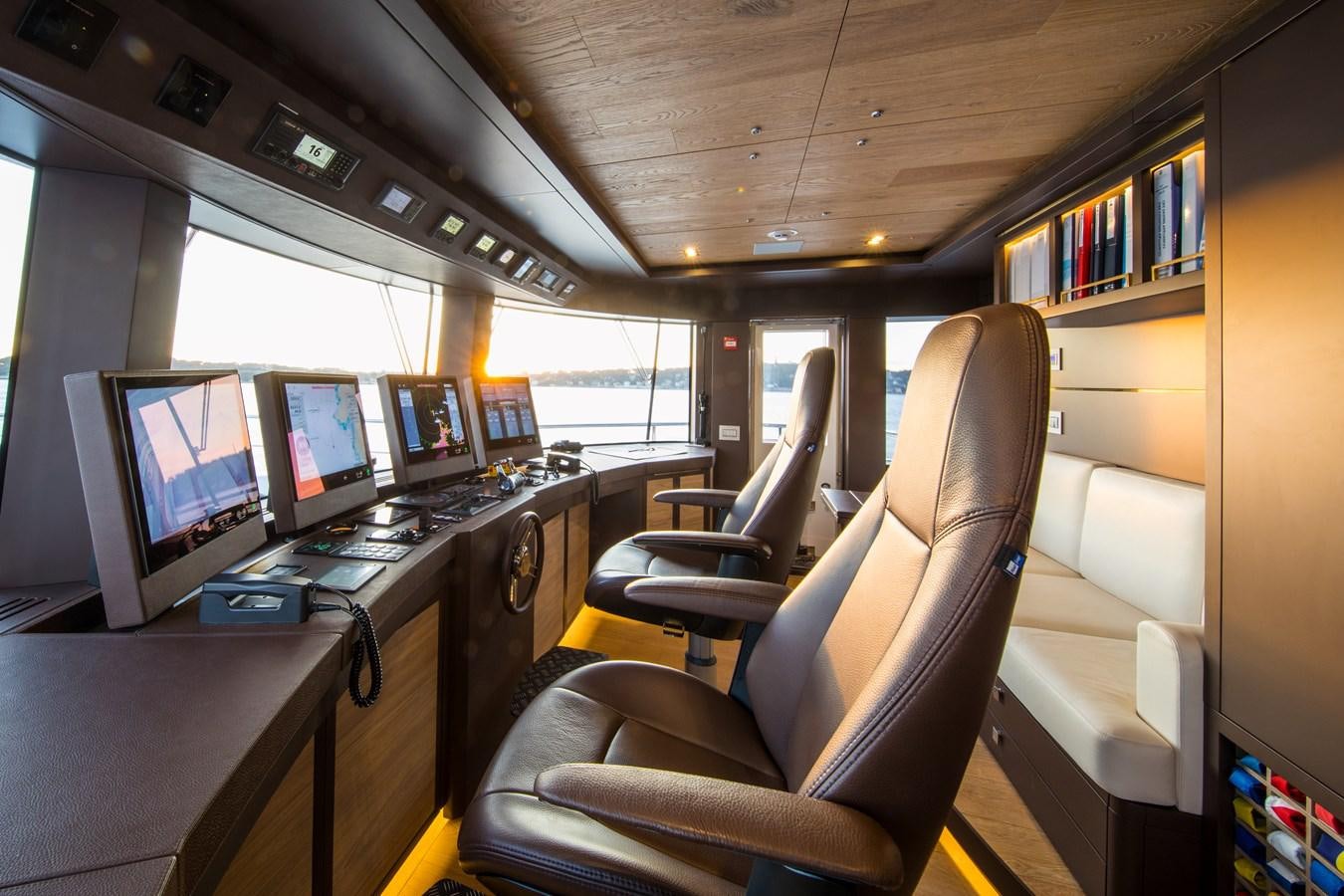 a room with computers and monitors aboard SABAI Yacht for Sale
